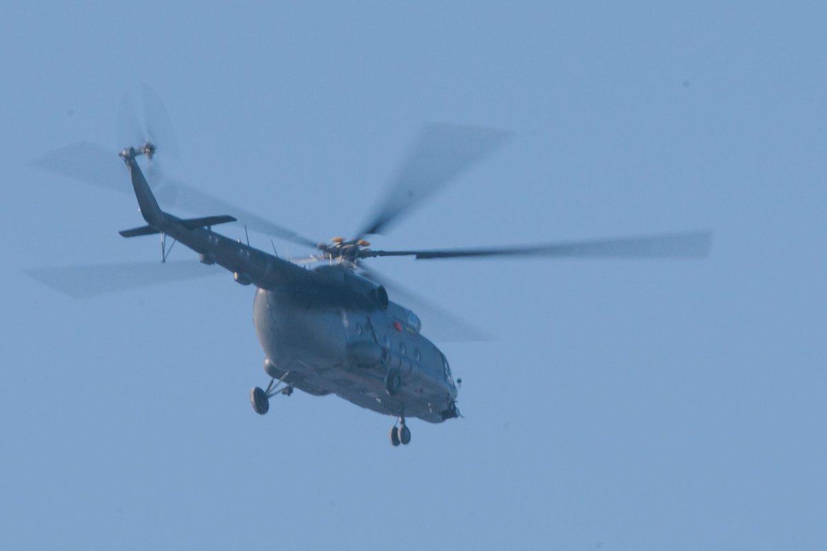 Military helicopter, ground units are searching for a drone