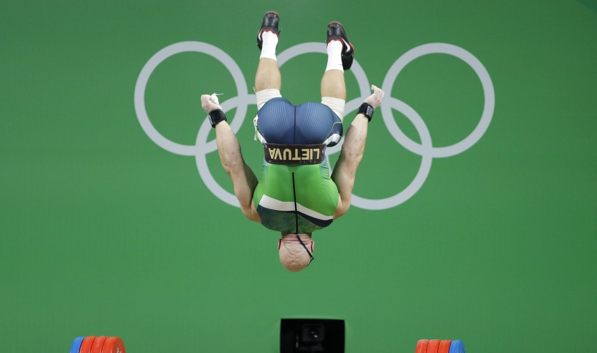 Aurimas Didžbalis performing a somersault after a win