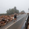 Sumaištis Ispanijoje: dėl potvynių atšaukta dalis skrydžių, nuo bėgių nuslydo traukinys