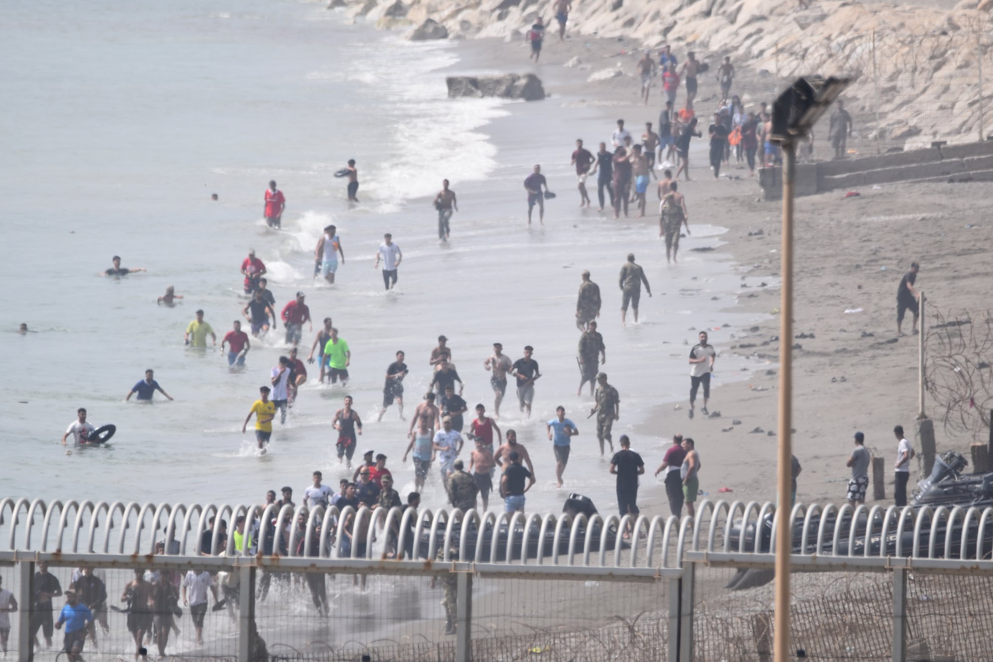 Spain deploys troops as over 1,500 migrants arrive in Ceuta