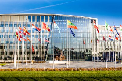 Brussels, Belgium - November 10, 2022: NATO building headquarters with flags and symbol